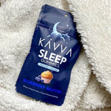 blueberry-muffin-sleep-kavva-delta-9-gummy-packaging-tucked-in-white-fuzzy-soft-blanket-kavva-2023