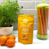 tangerine-joy-kavva-delta-9-gummy-packaging-on-kitchen-counter-kavva-2023