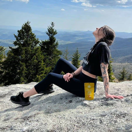 woman-happy-overlooking-mountains-joy-delta-9-kavva-gummies-kavva-2023